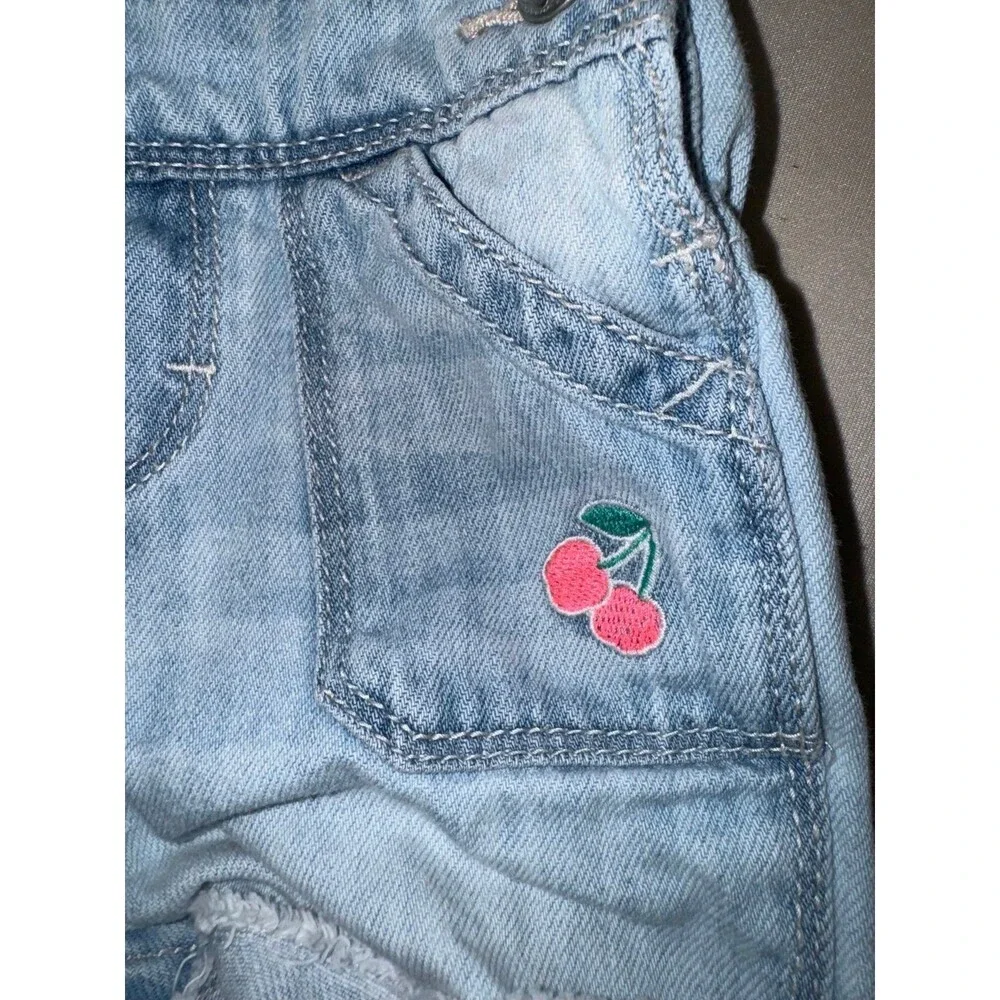 Oshkosh denim shortfalls with cherries on the pocket size 6-9 months